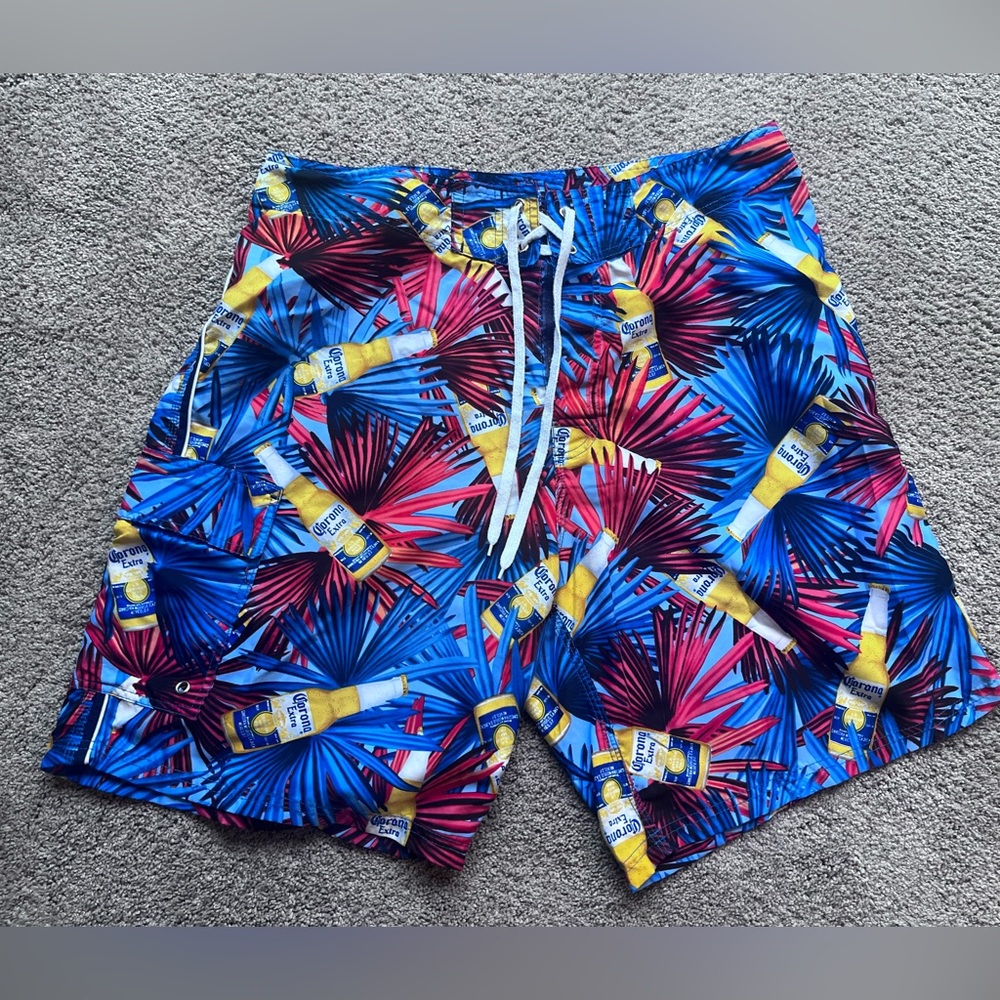 Corona Extra print swim trunks. Size 36. Excellent preowned condition.